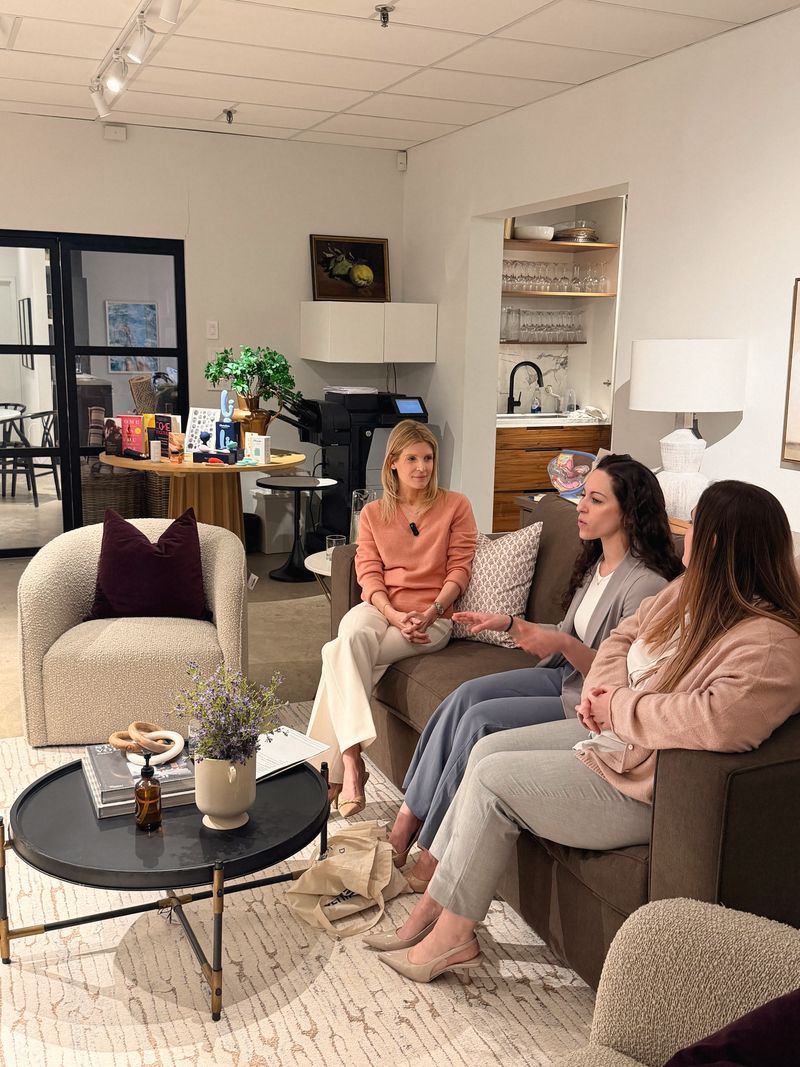 Dr. Say Kerner in conversation with two physicians on a sofa